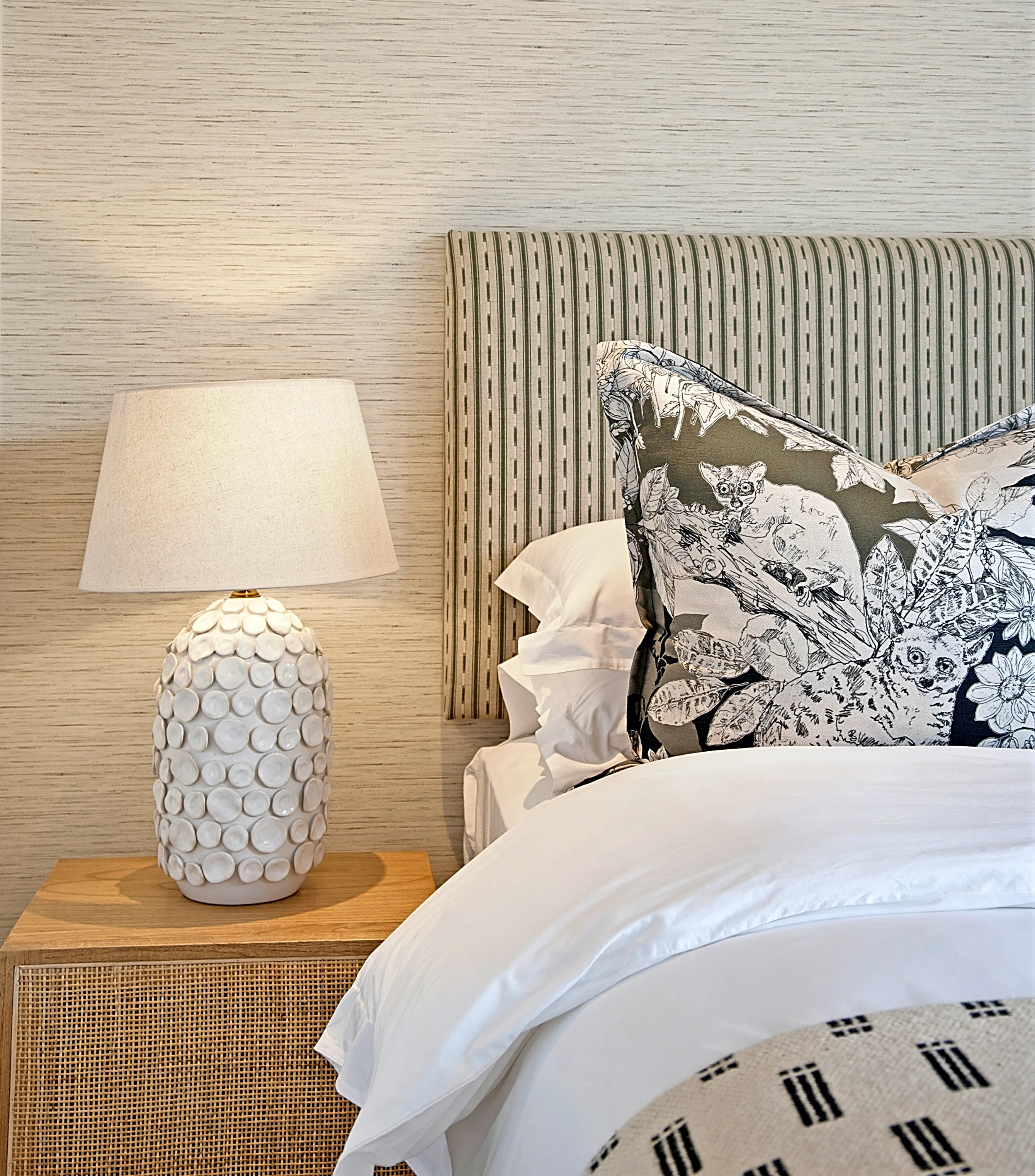 Guest bedroom 2 at Simbithi Eco-Estate: striped headboard, printed cushion and petal-relief lamp