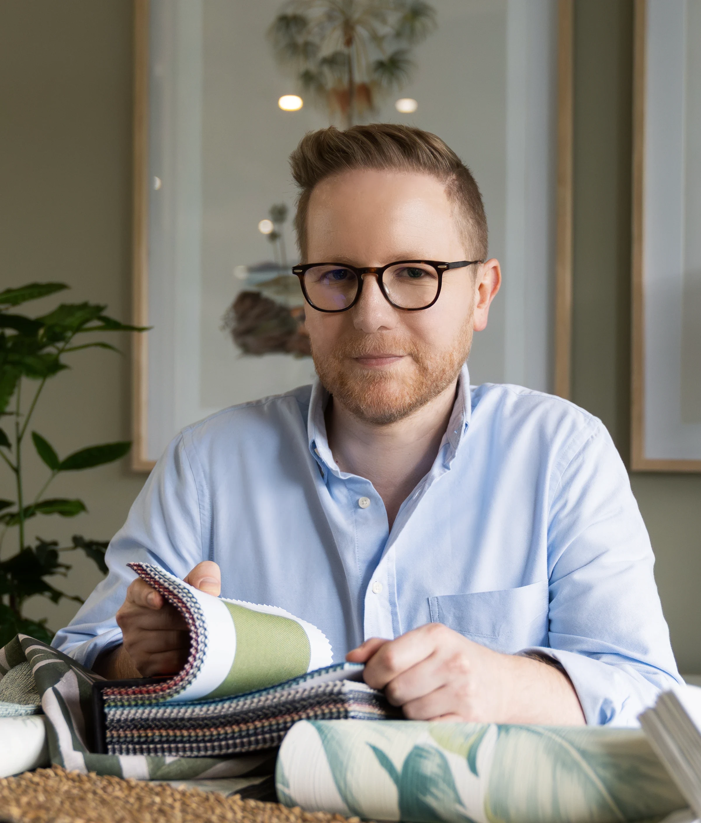 Jonathan Avnon with fabric samples in the studio