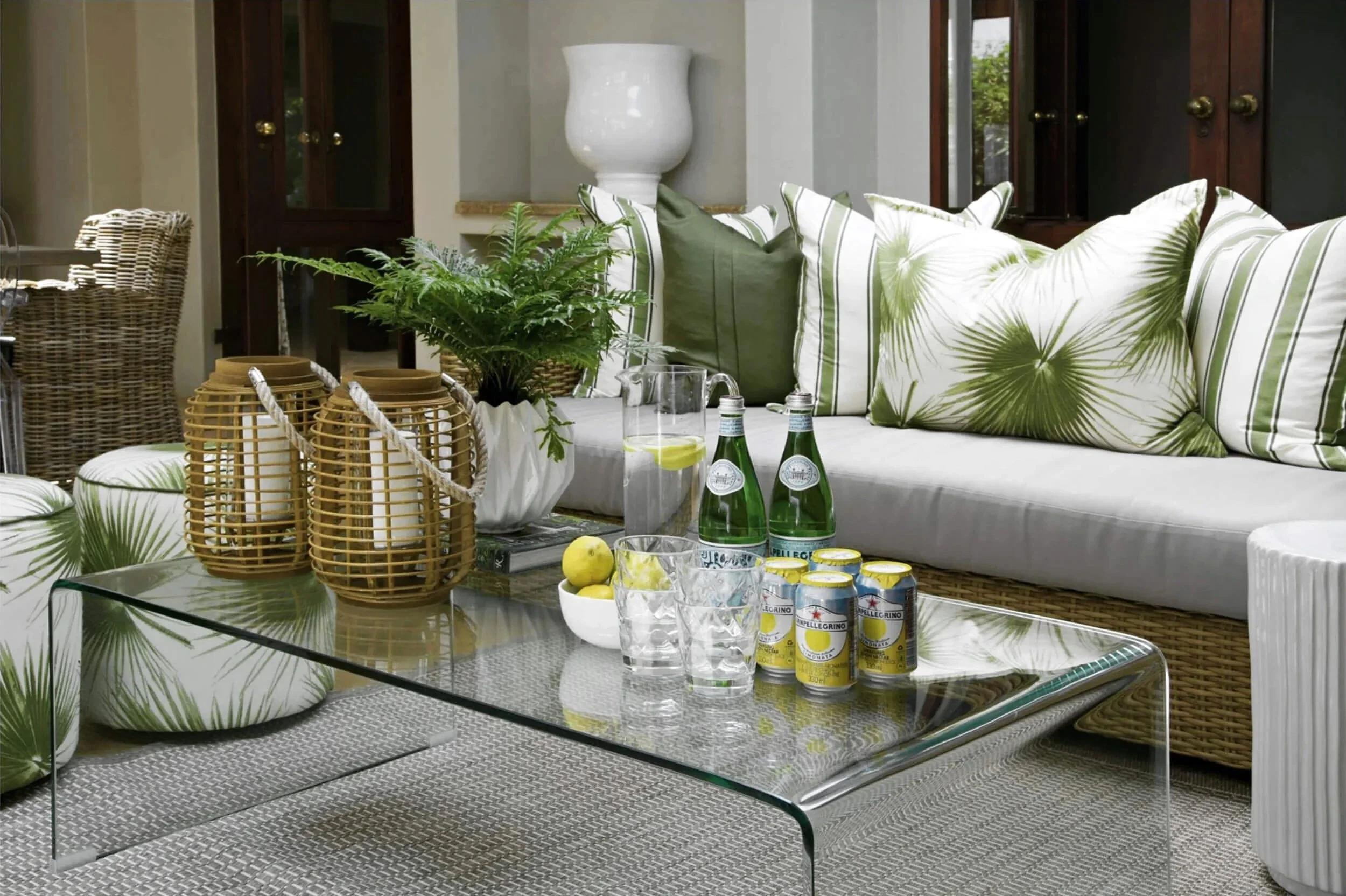 Living room in Johannesburg with a glass table and green cushions